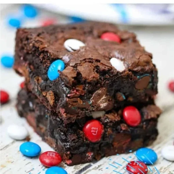 Delicious fudgy gooey brownies fresh out of the oven, topped with chocolate chips.