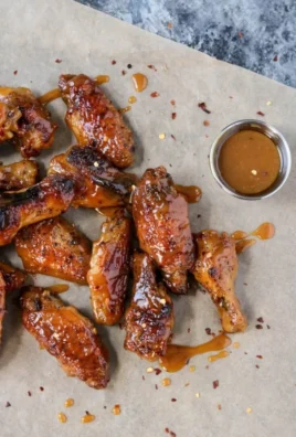 Hot honey mustard wings served on a platter with dipping sauce
