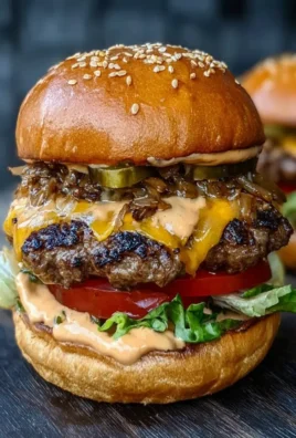 Juicy smash burger on a grill with toppings ready for BBQ