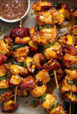 Jalapeno Peach Chicken Skewers prepared for grilling with colorful ingredients.