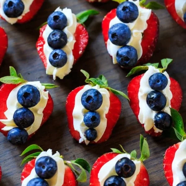 Delicious red, white, and blue cheesecake strawberries dessert for summer events.
