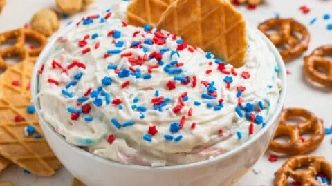Delicious Red, White and Blue Funfetti Dip served in a festive bowl.