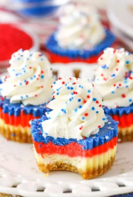 Red, white, and blue mini cheesecakes decorated for a festive celebration