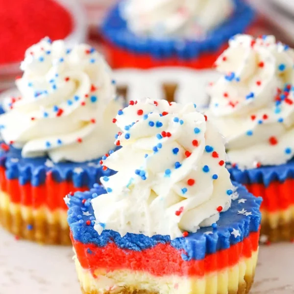 Red, white, and blue mini cheesecakes decorated for a festive celebration