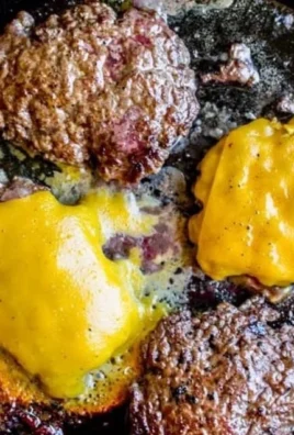 Delicious homemade smash burger with toppings on a wooden table