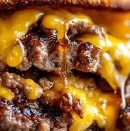 Crispy Smash Burger double cheeseburger with toppings on a plate
