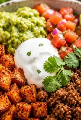 Delicious sweet potato taco bowl topped with fresh ingredients and spices