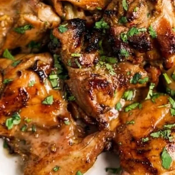 Delicious Thai grilled chicken garnished with herbs and spices