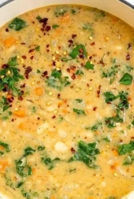 Delicious homemade Tuscan white bean soup garnished with fresh herbs