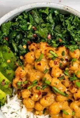 Colorful Vegan Buddha Bowl filled with fresh vegetables and grains