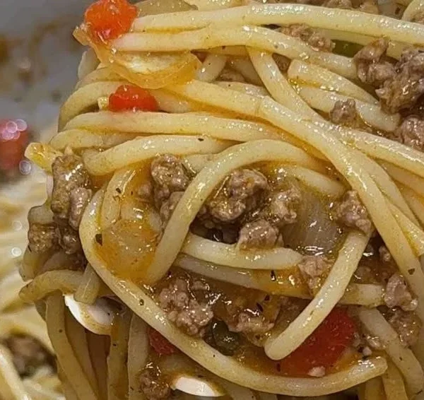 Viral Dirty Spaghetti dish topped with sauce and fresh herbs