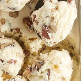 Delicious homemade Butter Pecan ice cream in a bowl with pecans on top