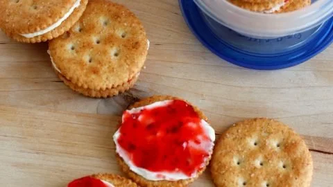 Plate of cream cheese and jam cracker snacks ready to be enjoyed