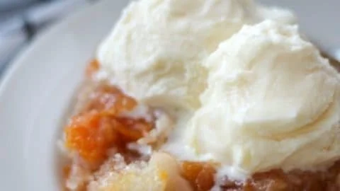 Homemade peach cobbler made with fresh peaches and a golden crust.