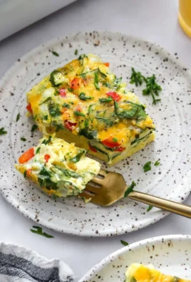 High-protein cottage cheese egg bake served in a dish with fresh herbs