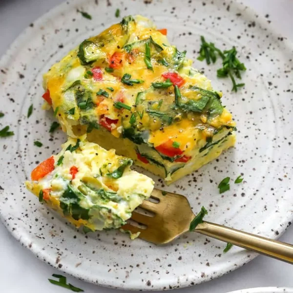 High-protein cottage cheese egg bake served in a dish with fresh herbs