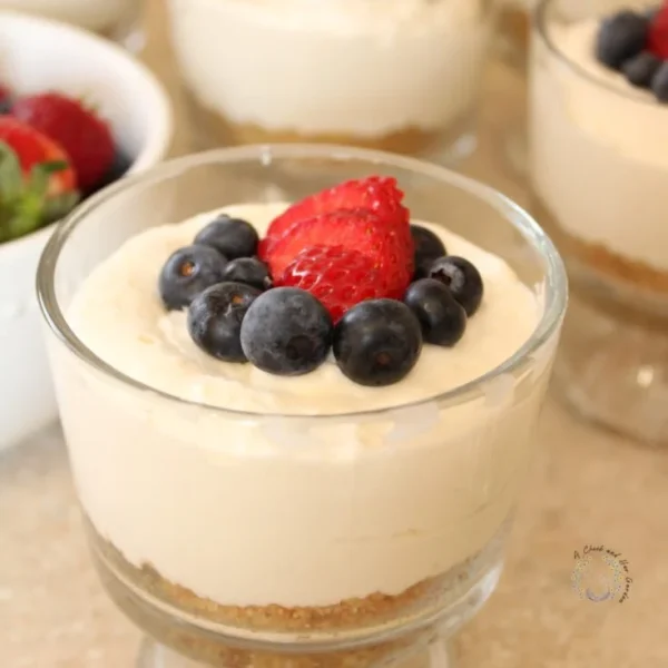 Individual no-bake cheesecake cups dessert in a clear cup