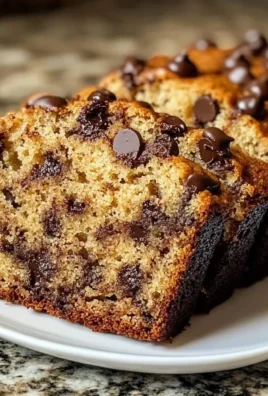Moist chocolate chip banana bread with melting chocolate chips and ripe bananas