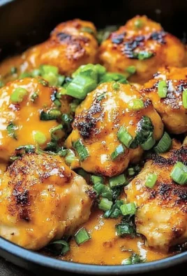 Delicious low carb bang bang chicken served with fresh herbs and vegetables.